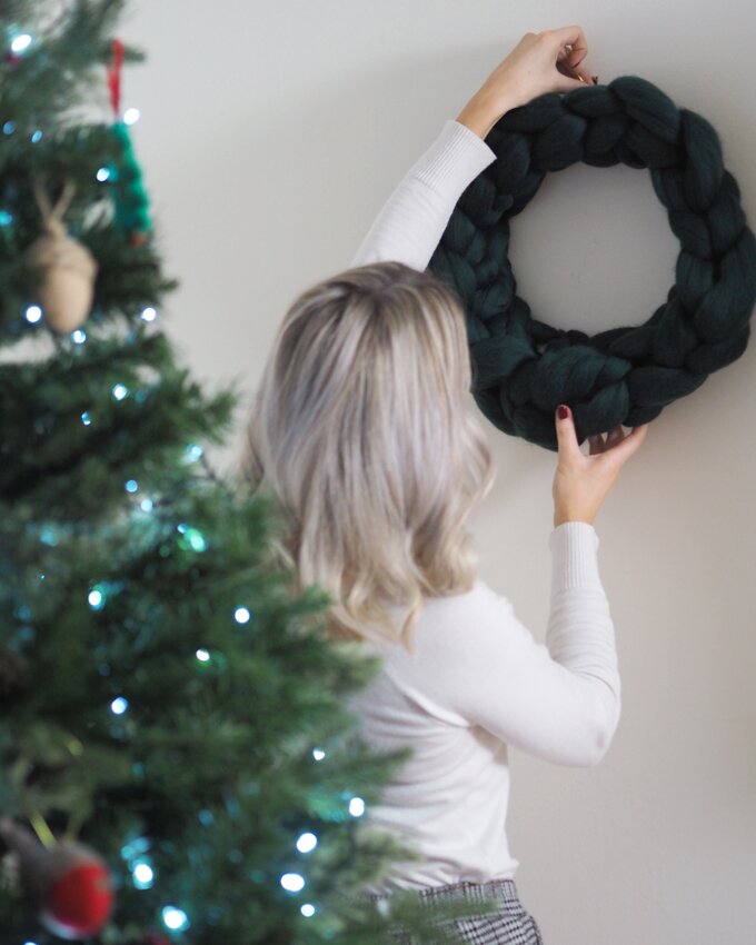 Crocheted Wreath Kit with Wool Couture hanging the wreath